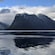 The Hjørundfjorden in Norway with a body of water and lush mountains